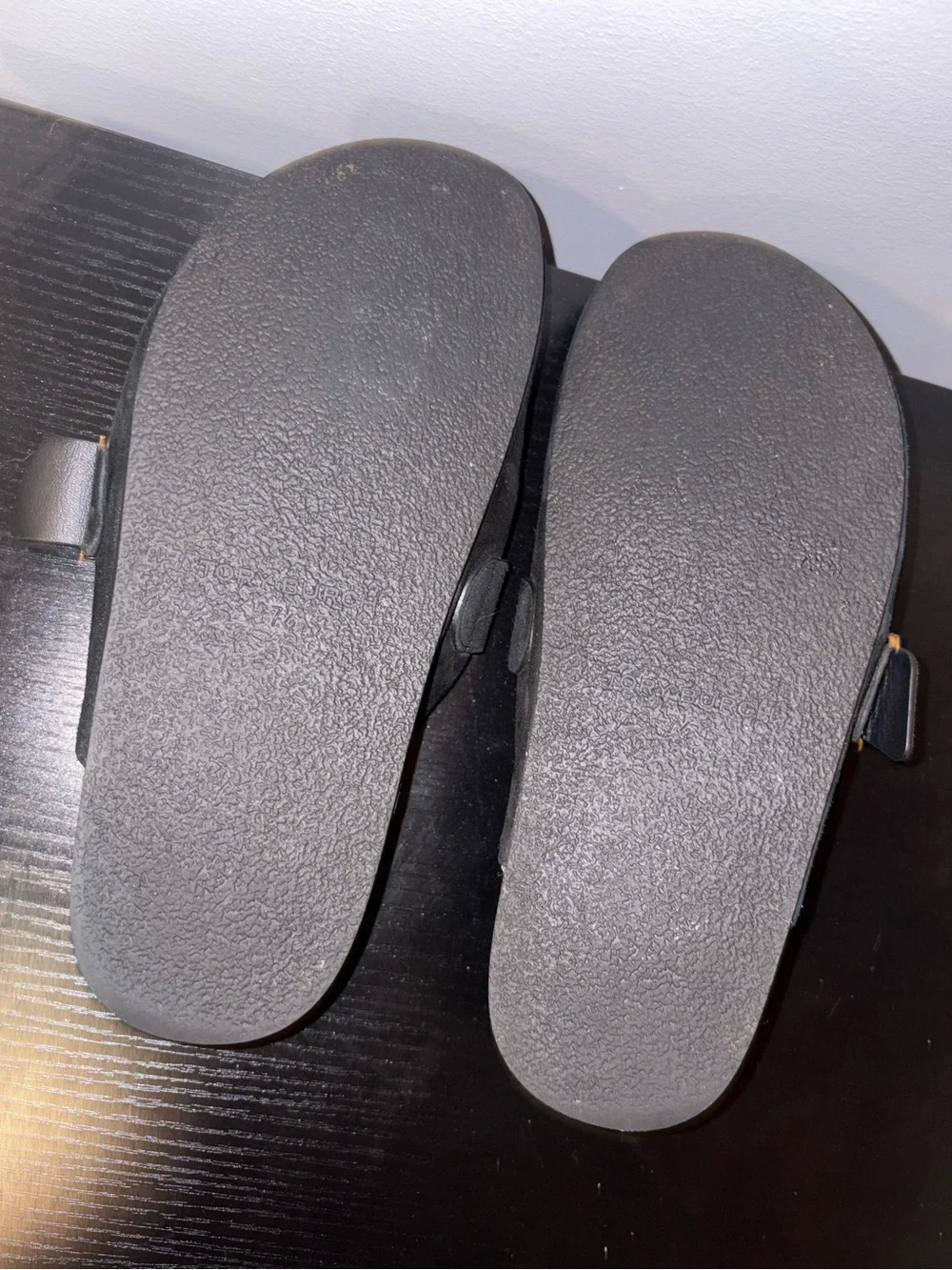 Tory Burch black suede slip-on mules in a size 7.5